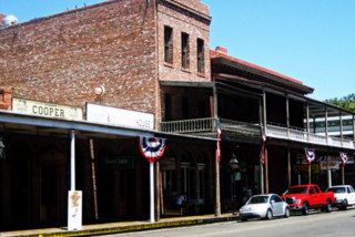 Restored Buildings and Wooden Sidewalk by Suzi Rosenberg